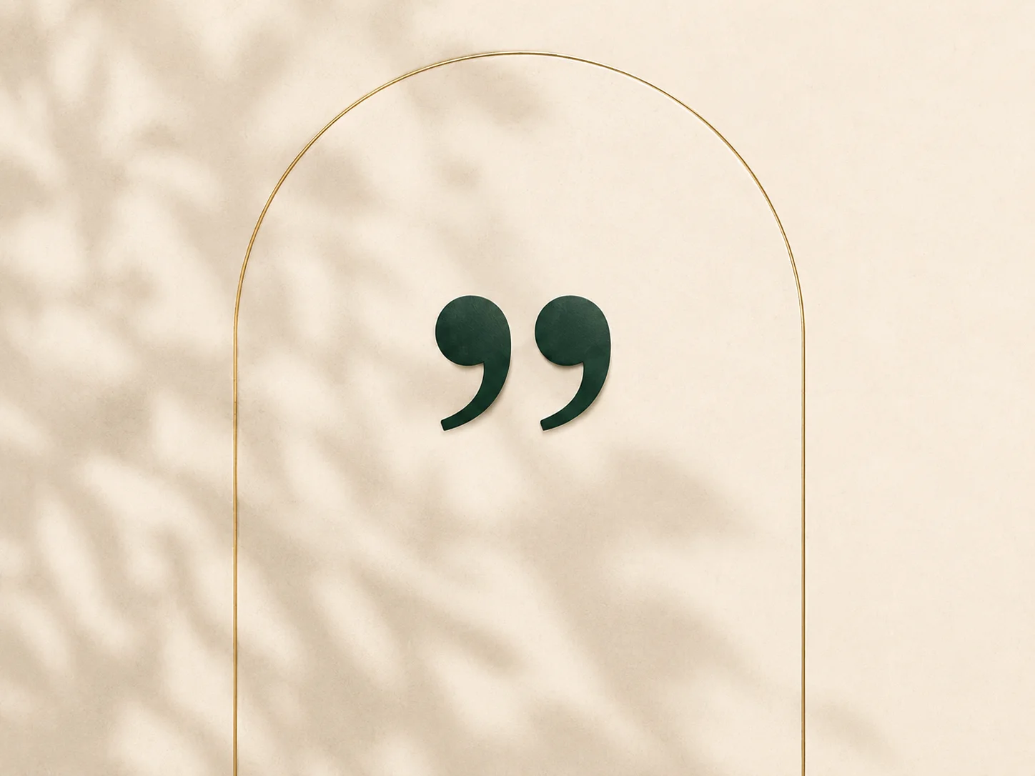 Dark green quotation marks inside a gold arch on a soft beige background